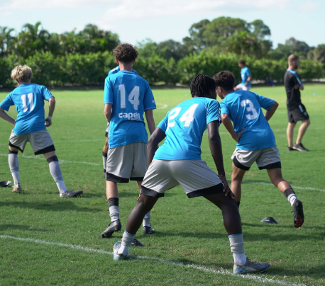 Athlete competing in a tennis match under bright lights.